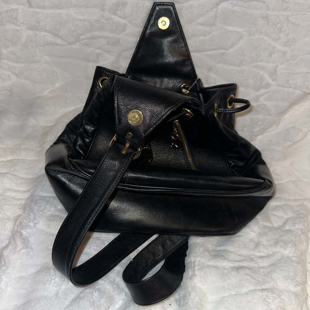 Vintage Cache leather backpack with gold hardware.